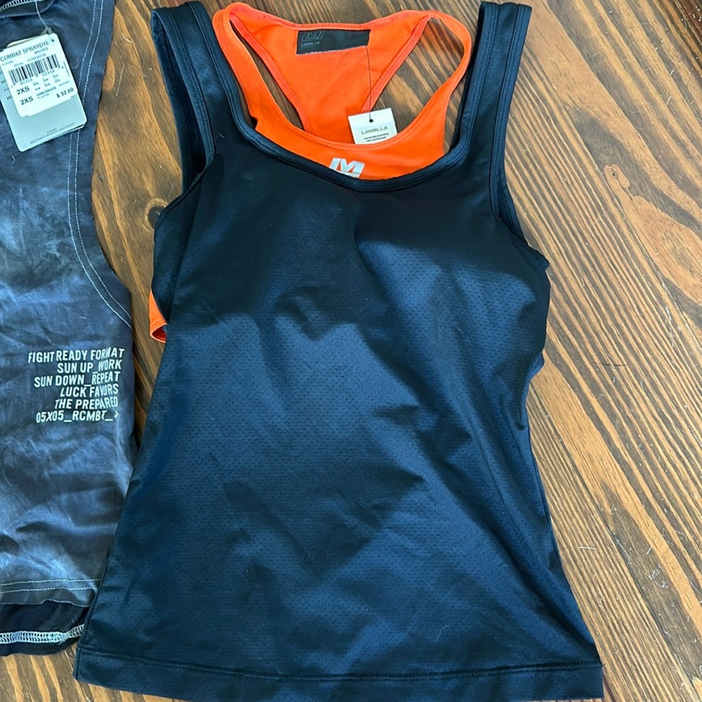 Les mills tank racerback XS NWT orange black